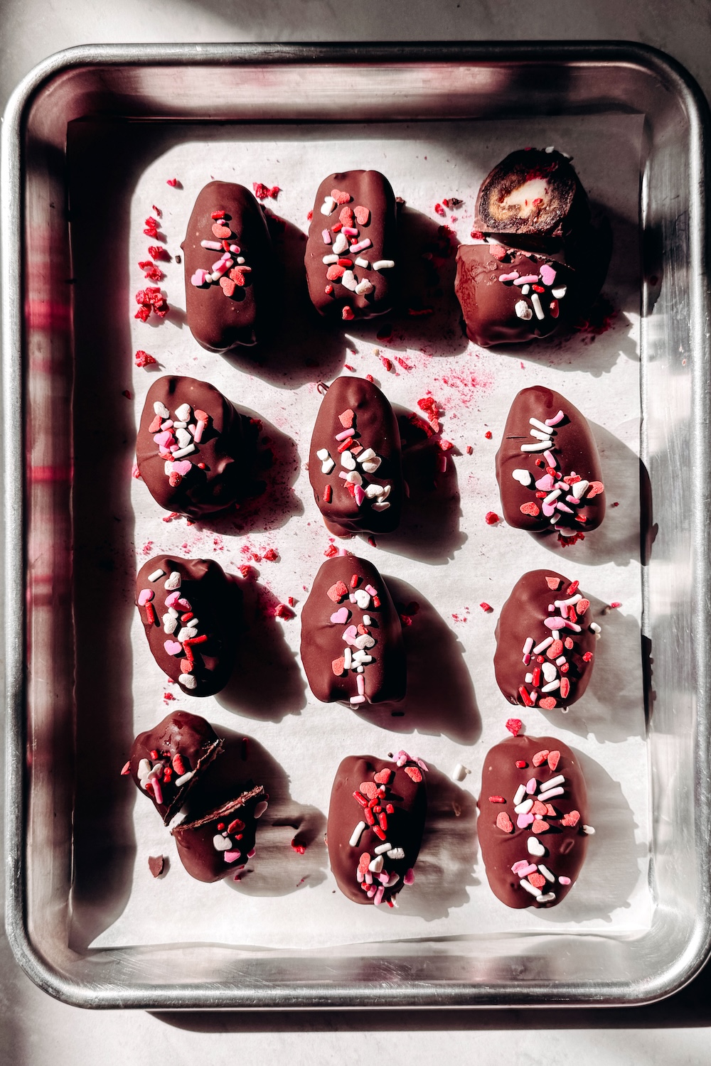 Stuffed Medjool dates with cheesecake filling and freeze dried raspberries