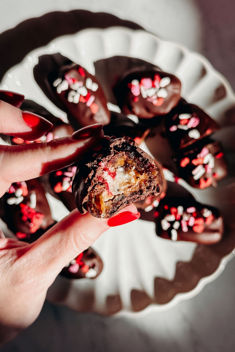 Stuffed Medjool dates with cheesecake filling and freeze dried raspberries
